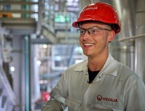 Veolia employee engineer smiling in industrial site