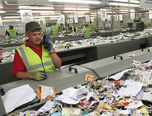 Veolia nottinghamshire employee checking recycling