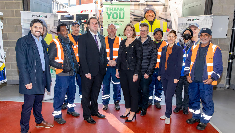 A Westminster Councillor and Veolia Senior Managers stand with their frontline colleagues infront of an RCV with the StreetKind advert on the side