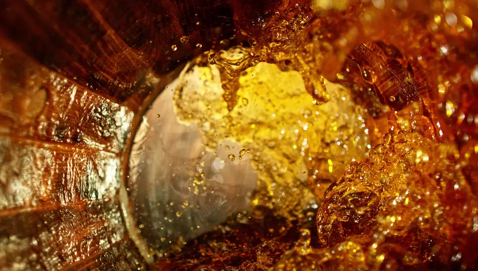 Whiskey flowing inside a barrel