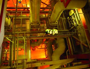 Two men standing on a gantry