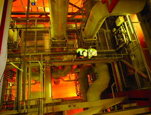 Two men standing on a gantry