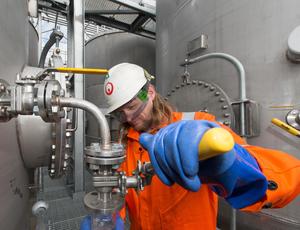 Veolia employee using machinery
