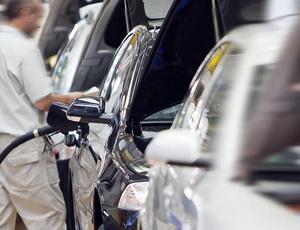 man filling up a car with fuel 