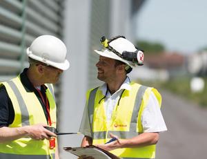 two workers talking 