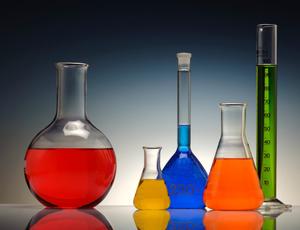 lab containers with bright liquid in it 