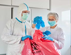 man and woman handling waste