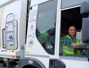 a woman working driving a lorry 