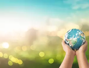 Community symbol of person holding up the earth 