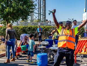 A Veolia operative throws his arms into the air and cheers