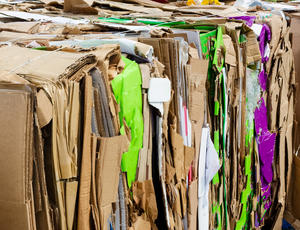 A photo of a bale of flattened cardboard.
