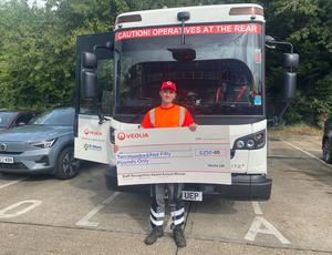 Veolia driver with cheque award
