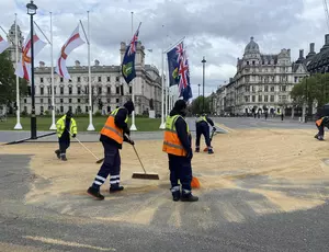 veolia workers in hi vis with brushes