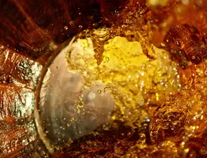 Whiskey flowing inside a barrel