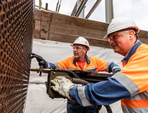 Veolia industrial services staff cleaning an oil gas heat exchanger