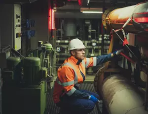 Veolia worker inspecting low-carbon heat network