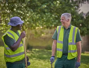 Veolia staff cleaning a green space