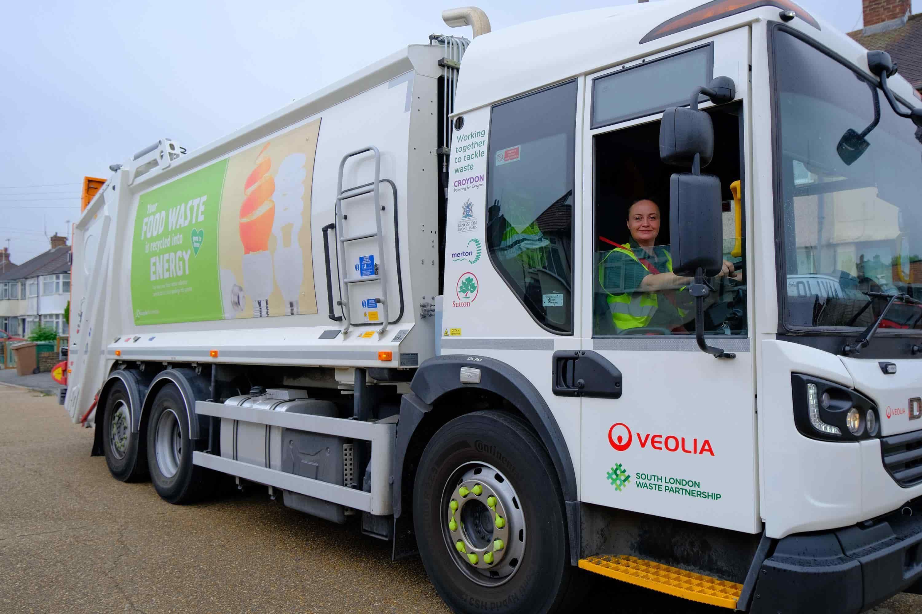 Female veolia waste truck driver