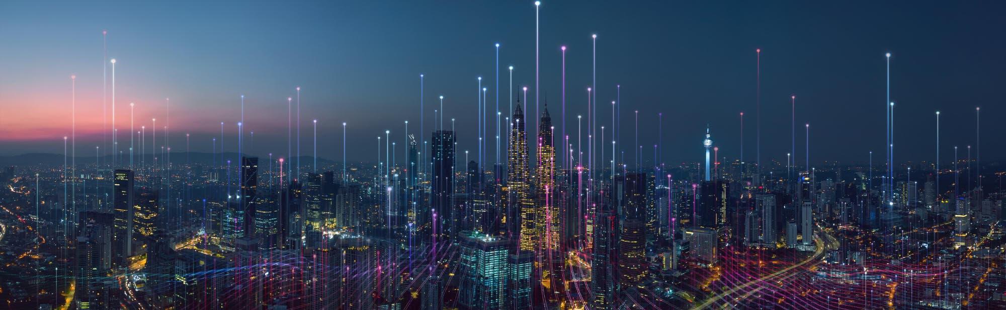 view of city sky scrapers lit up by lights