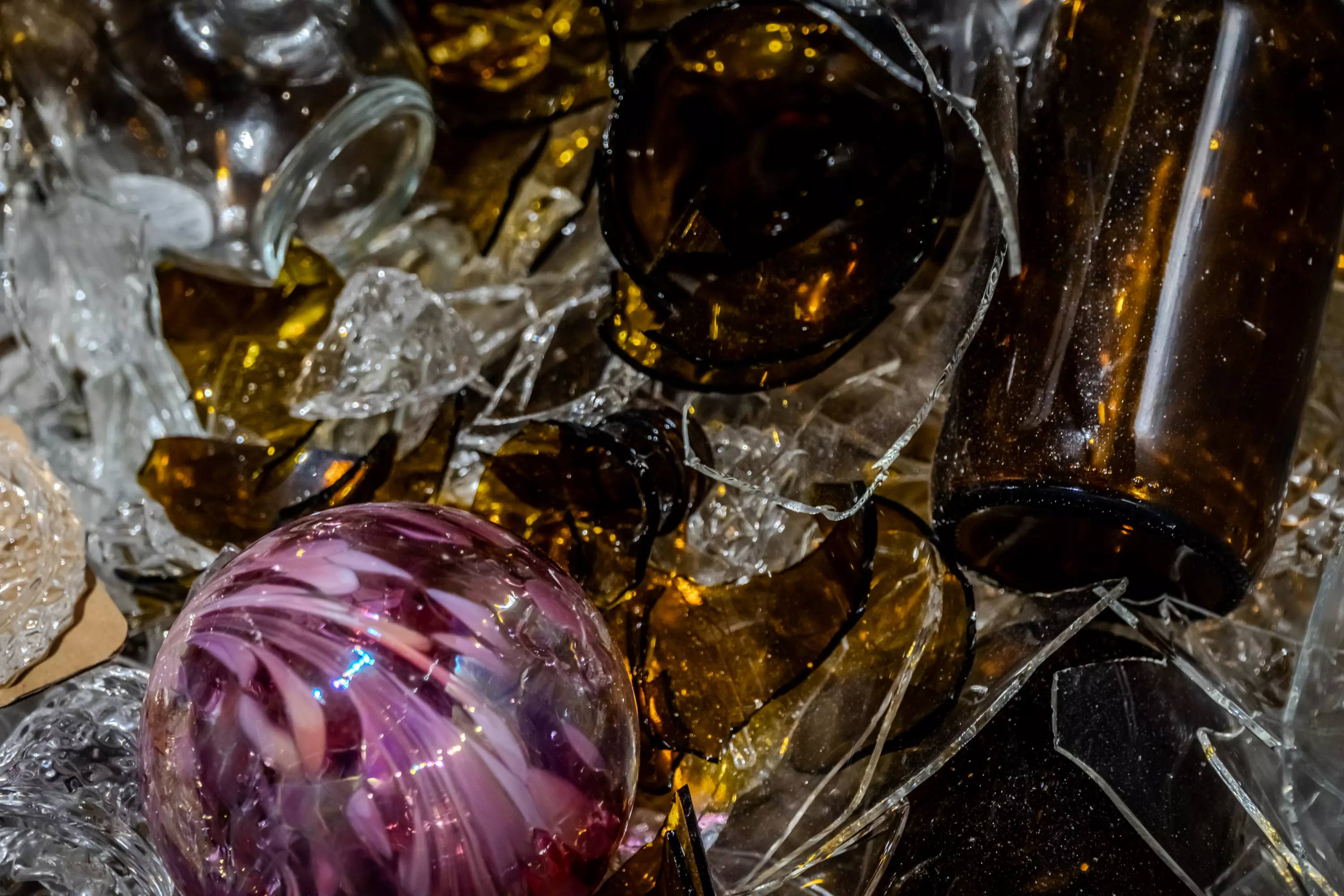 Broken glass bottles in a container