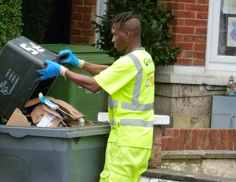 Man collecting bin