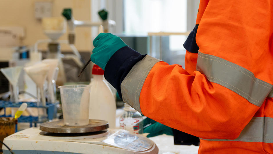 Veolia employee testing waste in laboratory