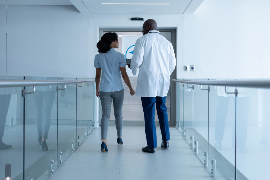 hospital staff walking down corridor