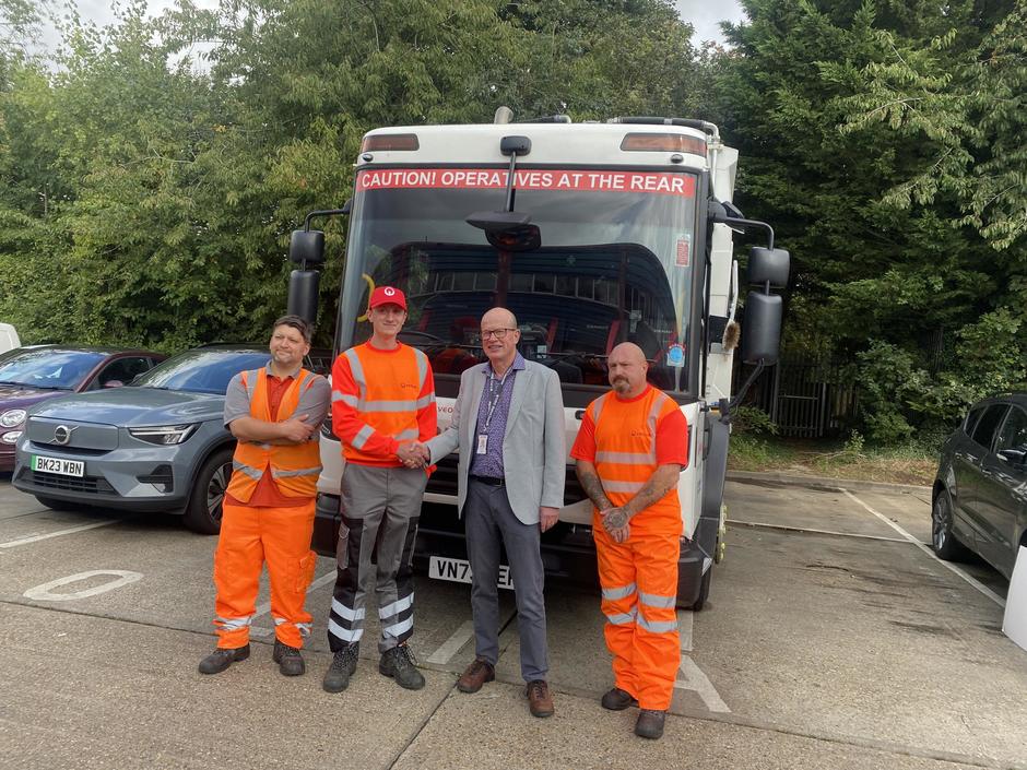 Veolia staff in front of waste truck