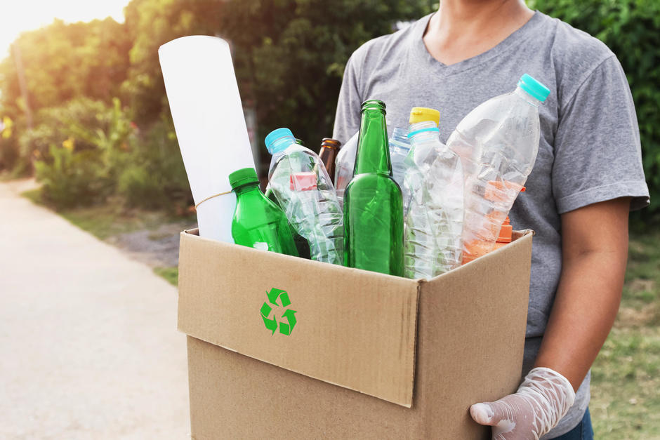 Man carrying box of recycling