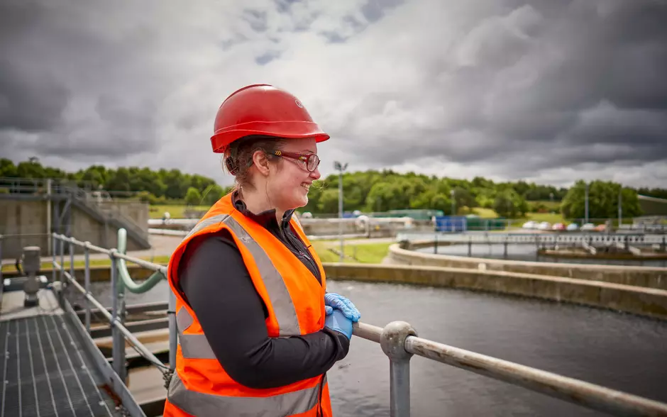 Female veolia employee water treatment plant
