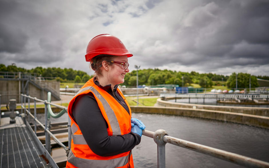 Female veolia employee water treatment plant