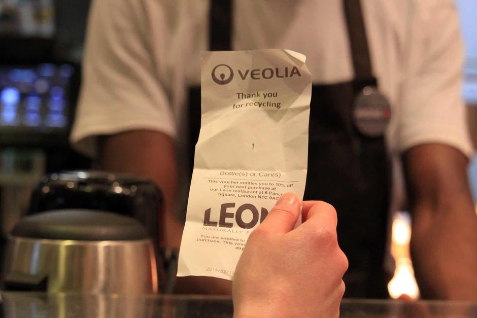 man holding a receipt 