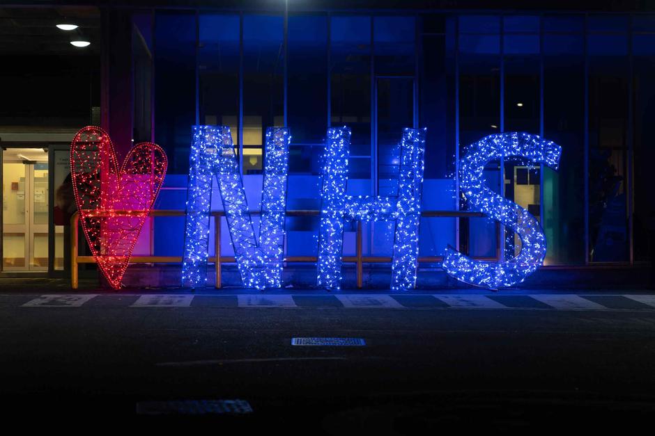 lit up NHS sign 