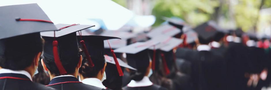 university students dressed in graduation hats 
