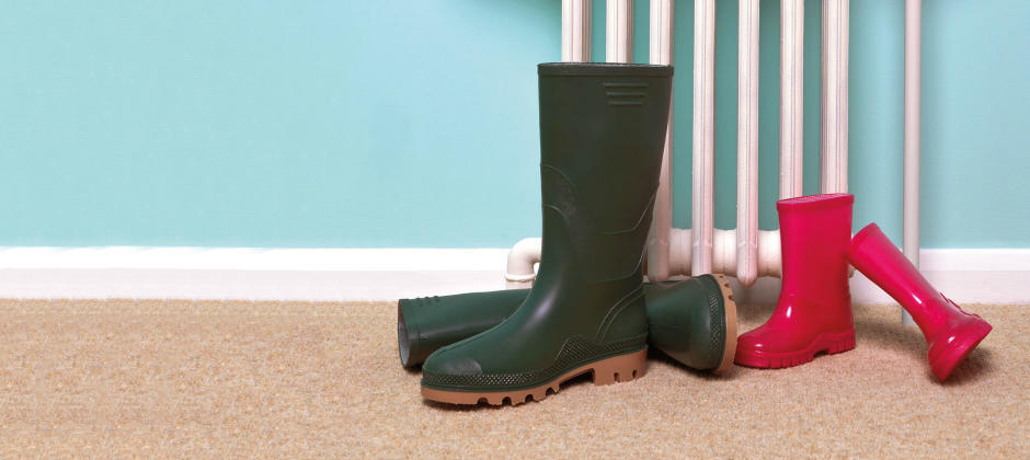 Wellington boots by the radiator 