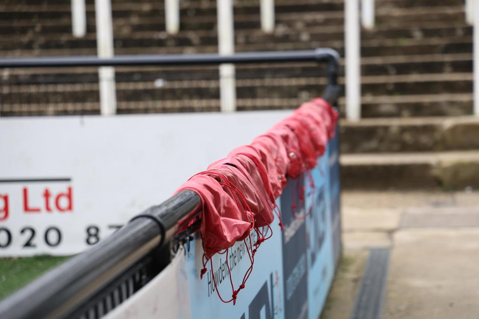 football bibs hanging over football stadium corners