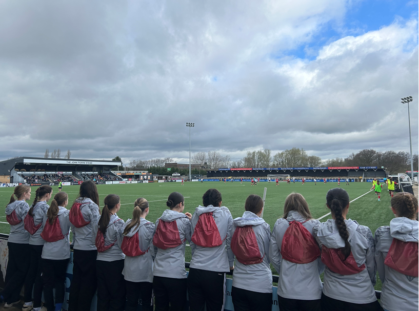 Football team standing side by side