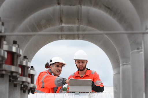 industrial water site workers in hi vis