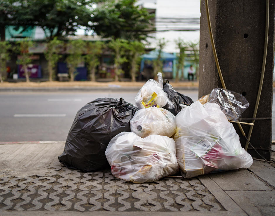 bags of general waste on street