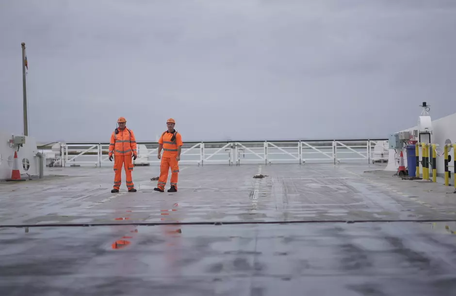 Two operatives stand on a P&O Ferries deck
