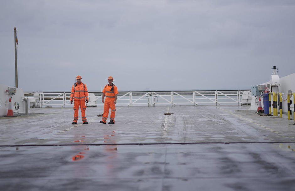 Two operatives stand on a P&O Ferries deck