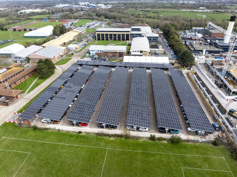 An aerial photo above the solar panel roof over the hospital car park.