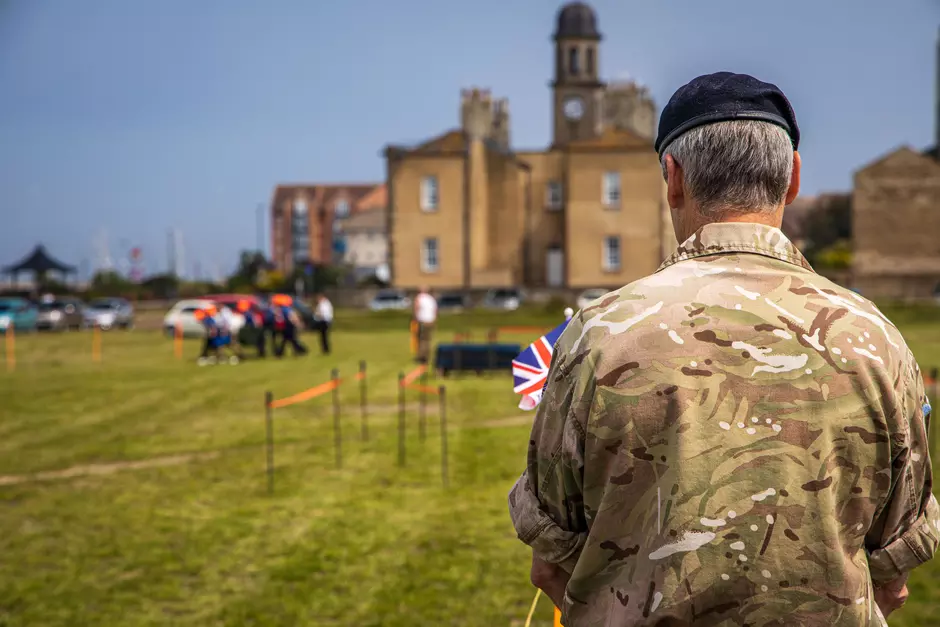 Soldier holding union jack flag 