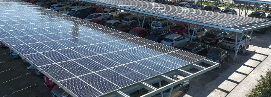 An aerial photo above the solar panel roof over the hospital car park.