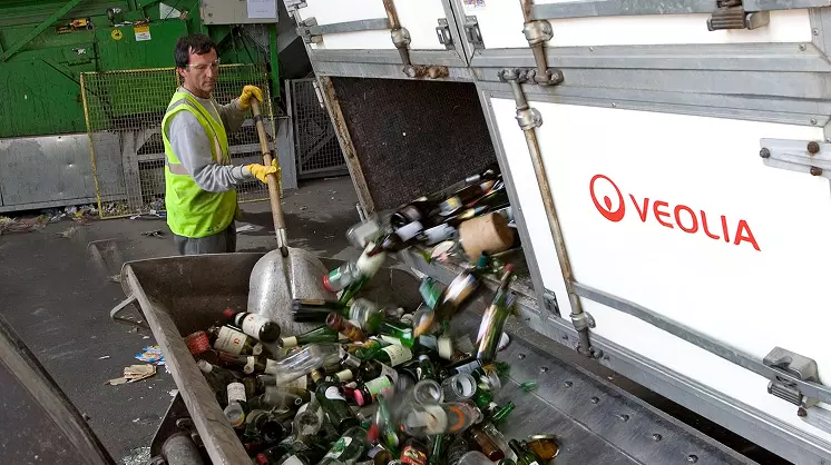 Veolia worker sorting glass waste
