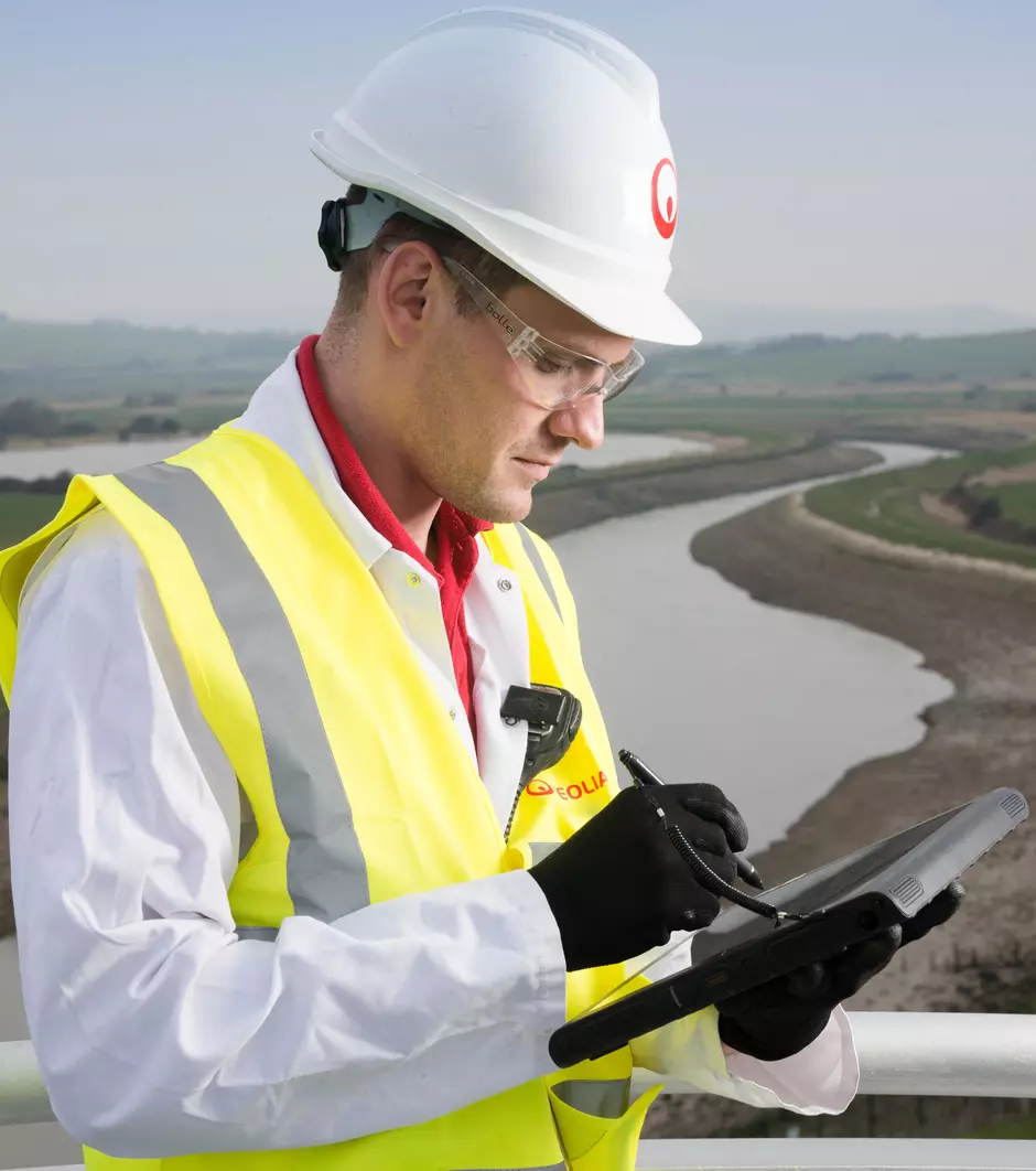 Veolia staff checking data and solutions at a customer plant