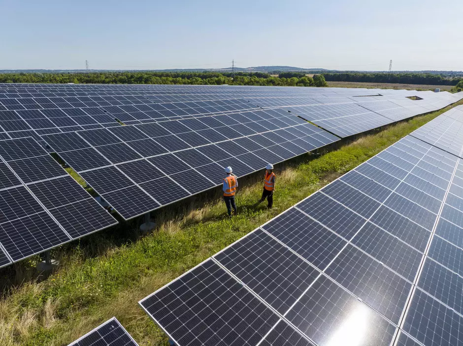 Veolia workers inspecting solar panels