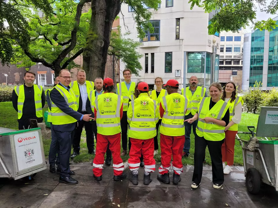 Team of veolia staff outdoors with high vis clothing lauching streetkind campaign
