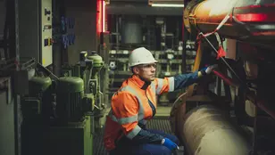 Veolia worker inspecting low-carbon heat network